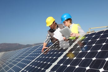 Man showing solar panels technology to student girl.jpeg